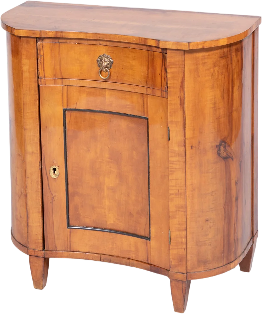 Außergewöhnlicher und zierlicher Biedermeier- Halbschrank mit konkav eingezogener Front und bombierten Schmalseiten.
