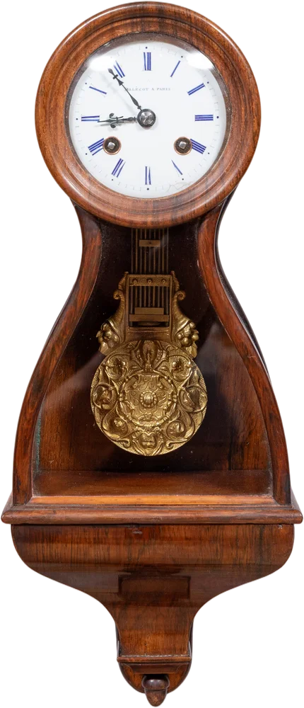 Seltene Wanduhr in Puppenkopfform (tête de poupée).