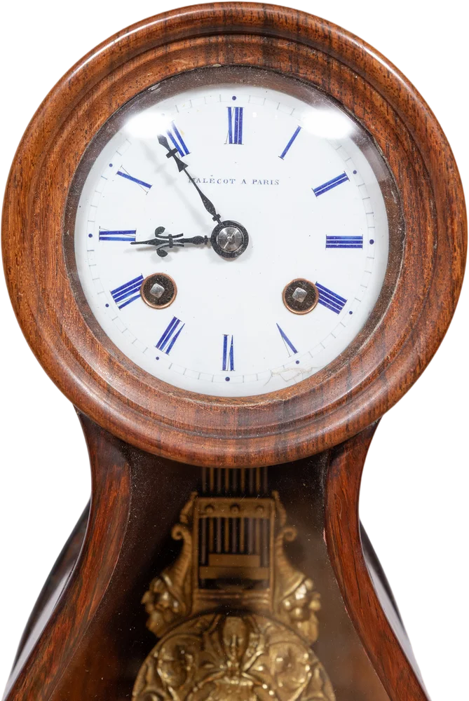 Seltene Wanduhr in Puppenkopfform (tête de poupée).